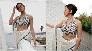 A admirer comments, “this is improvement,” as Sara Ali Khan wears a bralette and a saree-style skirt in Cannes